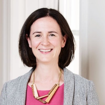 White woman with brown shoulder length hair