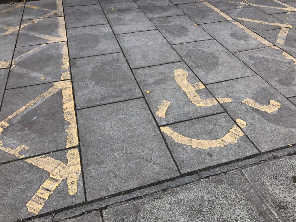 Handicapped parking space painted on road