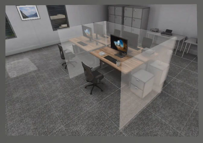 Virtual Reality office space showing four desks in a square each with a monitor, keyboard, telephone and black office chair, a couple of filing drawers to the left of the nearest desk, grey carpet, four filing cabinets in the corner of the room, and a table with printer on it. A couple of windows appear to be dark outside and reflect the room. A ghostly, translucent cubicle three walls divide the nearest desk.